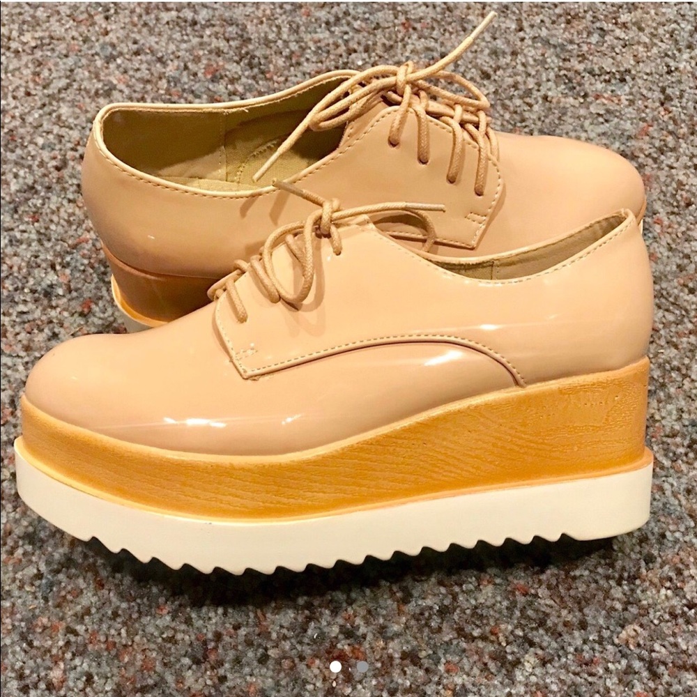 Patient pink Oxford platform shoes in size 9